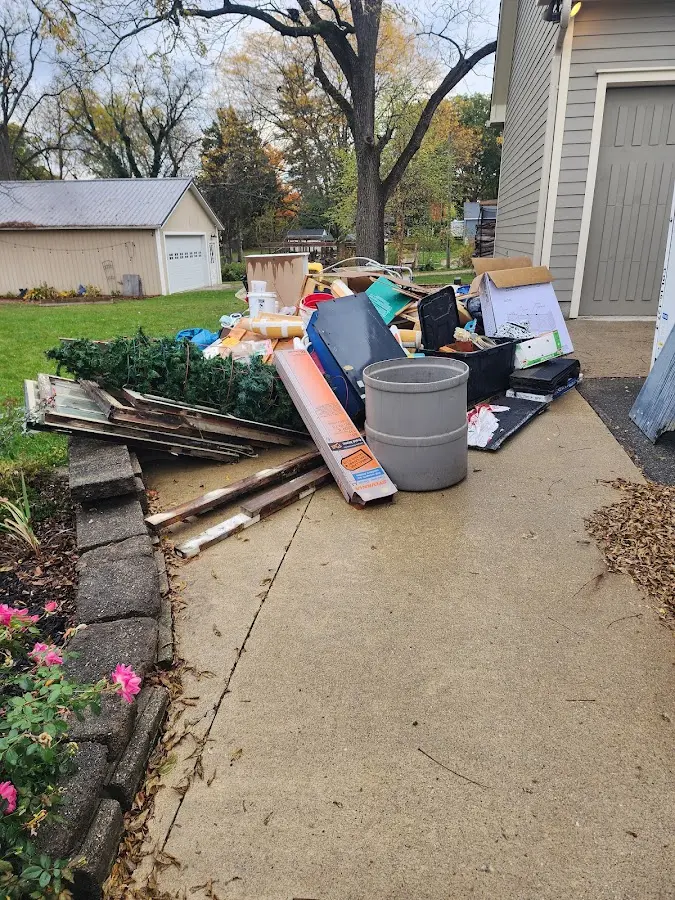 Dumpster being loaded with debris for 30 Yard Dumpster Rental in Forest Park